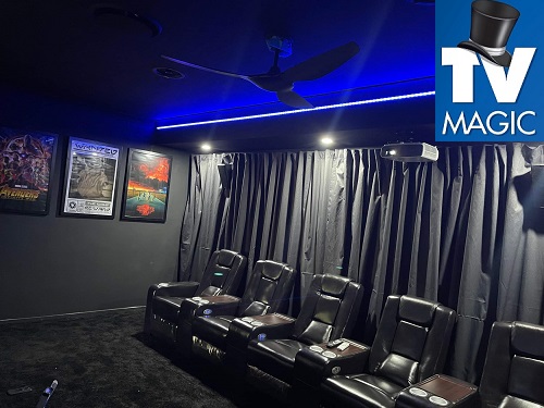 a completed home cinema showing seating and digital movie posters on side wall. TV Magic logo in top right corner