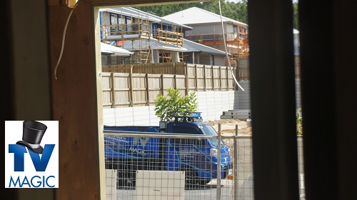 a partially completed home build with a TV Magic van out the front