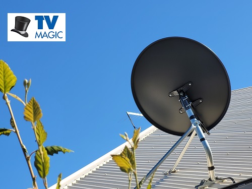 satellite dish installation on a tin roof with a TV Magic logo in the top left corner