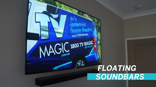 A large TV screen with a floating sound bar beneath it. Caption in bottom right which says floating sound bars