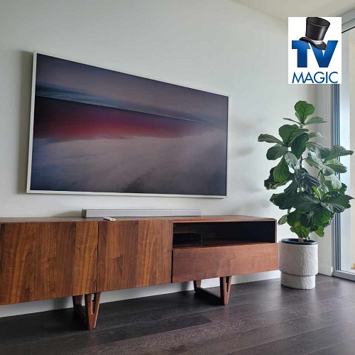 A TV mounted on the wall in a living room