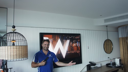 technician with a fresh TV installation job in a hotel