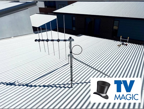 an antenna on a tin roof with a TV Magic logo in bottom right corner