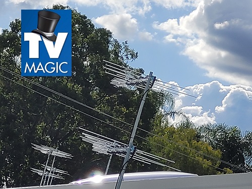 multiple antennas with trees in the background. TV Magic logo in top left corner