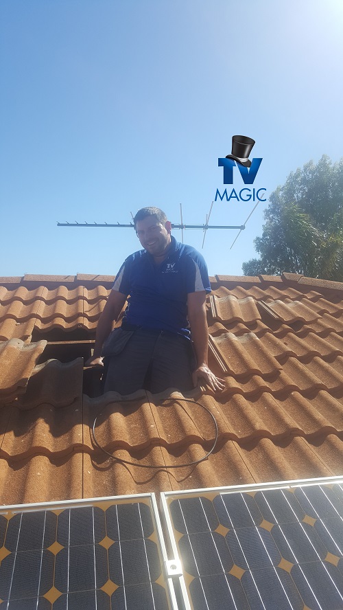 Technician installing an aerial