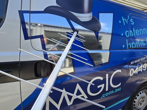 Close up of TV Magic van with antenna in front