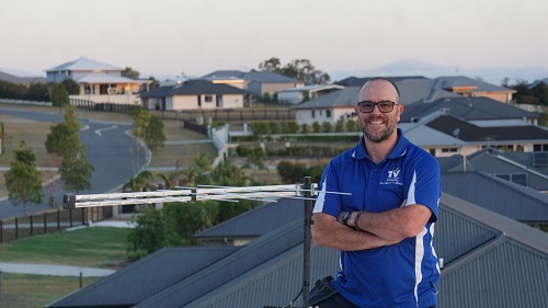 Technician with a new antenna installation