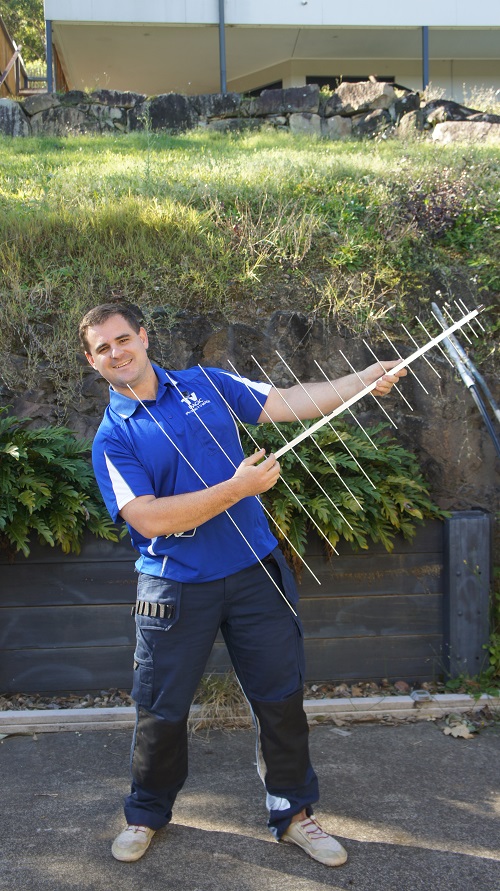 Technician holding an antenna