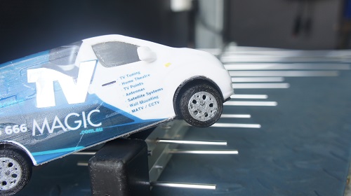 a close up of an antenna with a mini TV Magic van on top