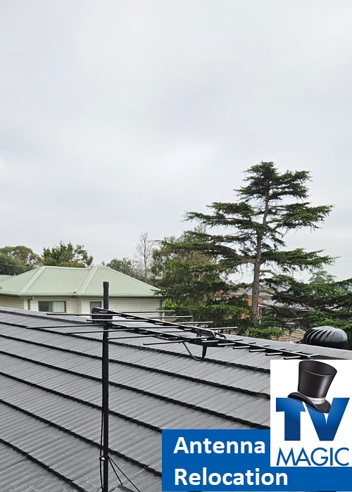 close up of an antenna on a tile roof. Caption "Antenna Relocation" and TV Magic logo in bottom right corner
