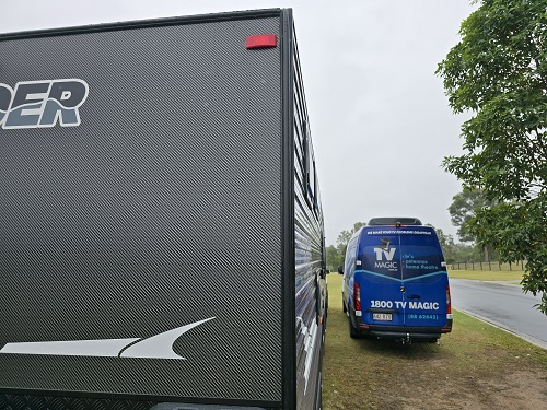 Caravan next to TV Magic van