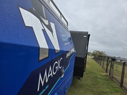 TV Magic van in front of a caravan