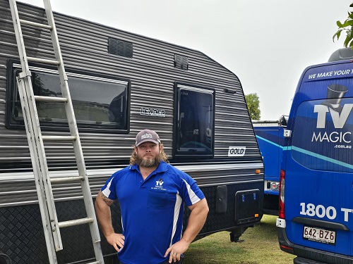 Technician next to van 
