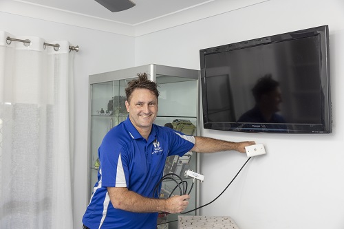 Technician sizing up for a new TV point