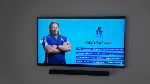 a wall mounted TV with technician on screen with services listed