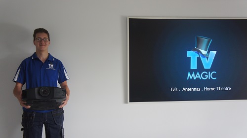 Technician holding a projector
