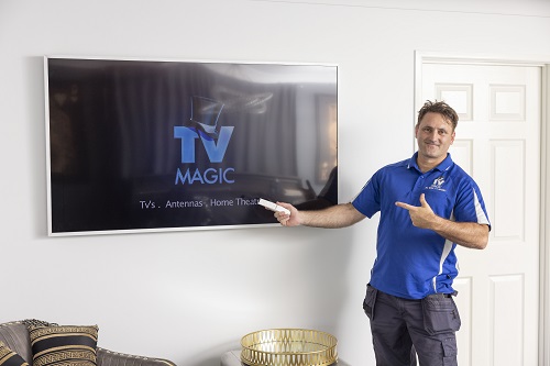 Technician with a Samsung Frame he installed for a client