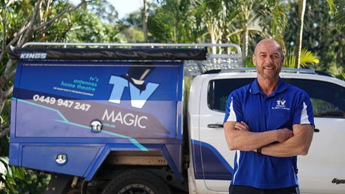 Technician - Darren, standing next to his vehicle