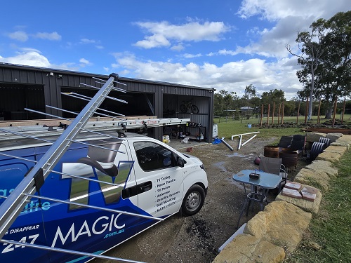 TV Magic van with antenna being held in front of it.