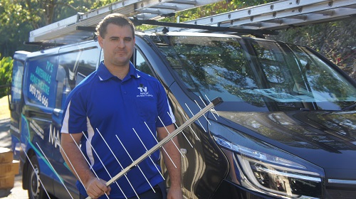 Technician with an antenna in hand