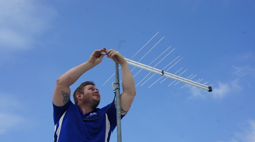 Technician - Nick, attending to a TV Reception Repair