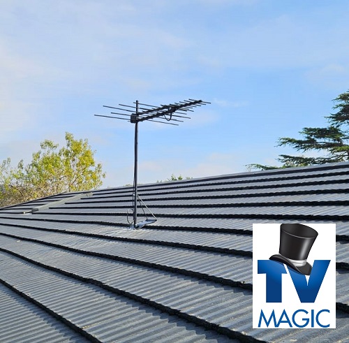 An aerial installed on a tile roof with TV Magic logo in bottom right corner