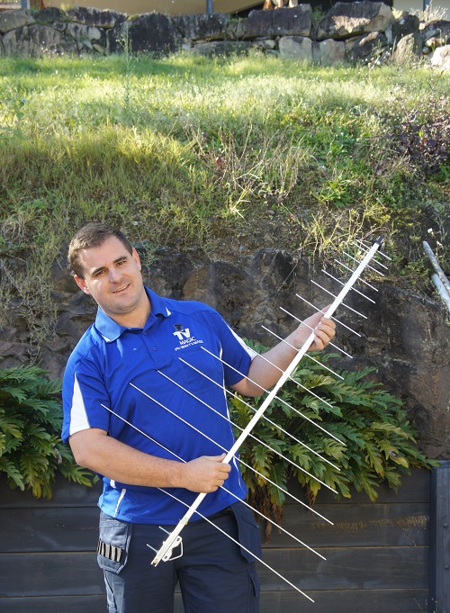 Technician holding an antenna