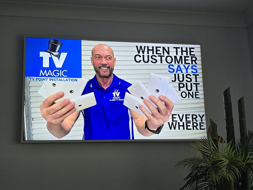 technician holding TV points in both hands