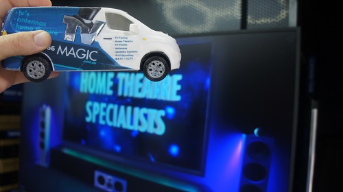 Mini TV Magic van being held up to a TV