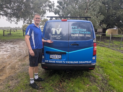 Technician - Lucas, at the rear of his TV Magic van.