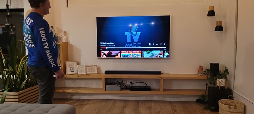 A Samsung Frame TV wall mounted in a living room