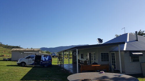 Country home with satellite dish installed by TV Magic