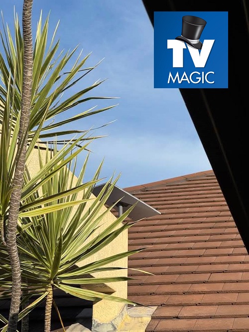 Starlink dish on a tile roof with TV Magic logo in top right corner