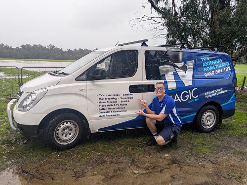 Technician - Lucas, next to his van.