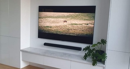 Picture of a wall mounted TV and floating soundbar
