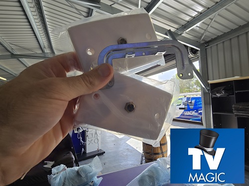 Technician holding a new TV point ready for installation