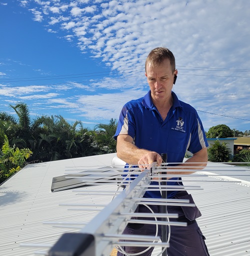 Technician testing an antenna signal