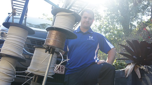 Technician next to his cabling rolls
