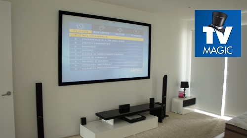A TV Magic projector setup with TV Magic logo in top right corner