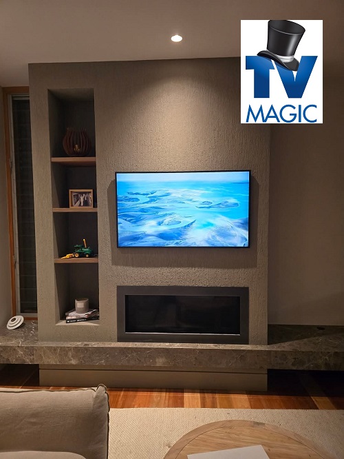 Tidy TV setup with a newly installed Samsung Frame with TV Magic logo