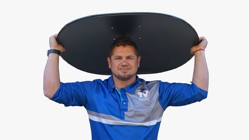 Technician with satellite dish on top of his head