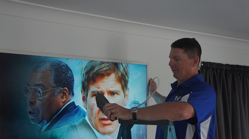 Technician tuning a large TV