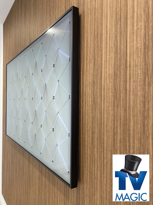 Close up of a TV with TV Magic logo in bottom right corner