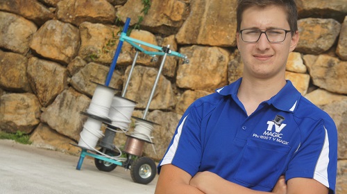 Technician with rolls of cabling for pre-wire fit outs