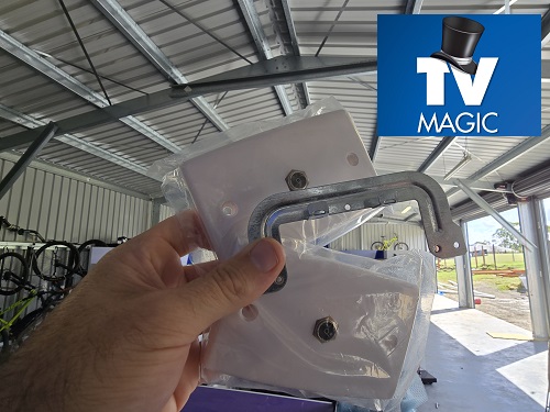 Technician holding a new TV outlet