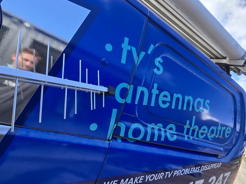 Close up of an antenna next to TV Magic van