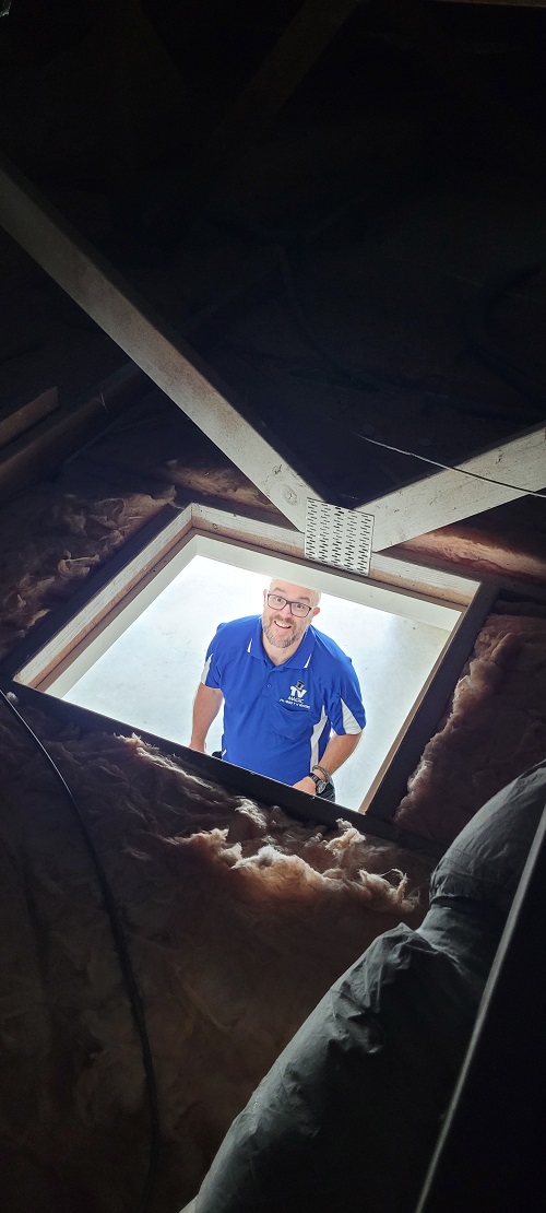 Technician - Vaughan looking up through man hole