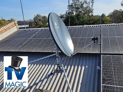 a satellite dish installation on a tin roof. TV Magic logo in bottom left corner