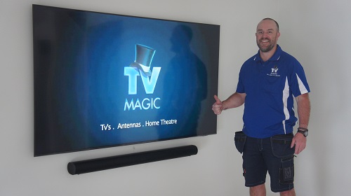 Technician - Vaughan, in front of a new TV and soundbar installation