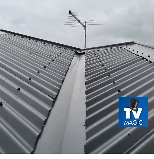 Angular view of a roof with TV Magic antenna. Logo in bottom right corner.